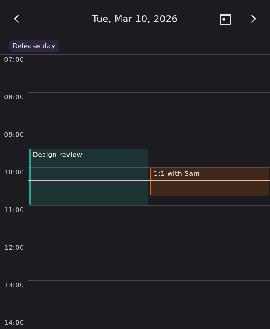 The day grid for Tuesday 10 March 2026, opened at 07:00. An all-day chip reading "Release day" sits above the grid; two overlapping meetings are packed side by side below it — a teal "Design review" from 09:30 and an amber "1:1 with Sam" from 10:00 — each drawn as a block whose height is its duration. A red now-indicator line crosses both blocks at 10:20.